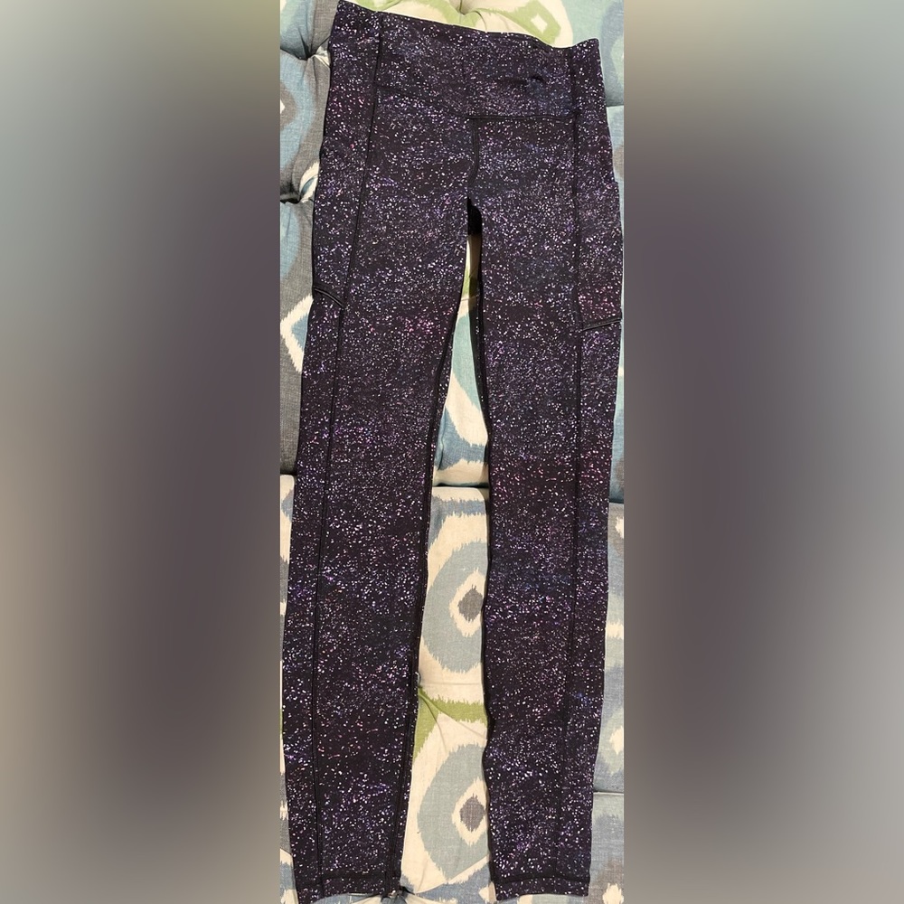Lululemon purple multi-colored galaxy leggings with pockets.